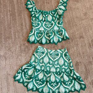 Embroidered lace two-piece crop top and skirt set.